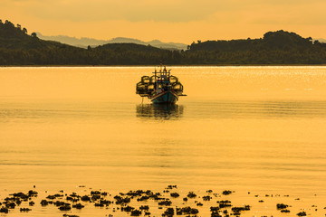 Floating fishing boat in the sea
