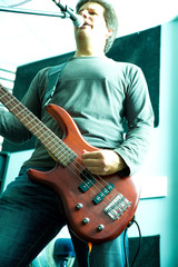 Obraz na płótnie Canvas Rock musician playing bass