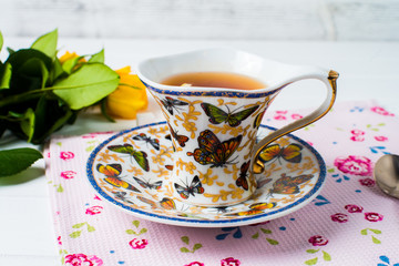 cups of tea with mint on wooden table