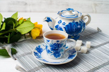 cups of tea with mint on wooden table