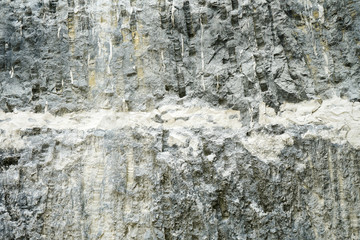 Obraz premium Old masonry made of limestone mine. Limestone is stratified of atmospheric influences and age. Background texture