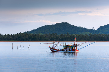 Floating fishing boat in the sea
