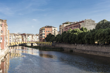 Girona city center river bridge on a blue sky sunny day