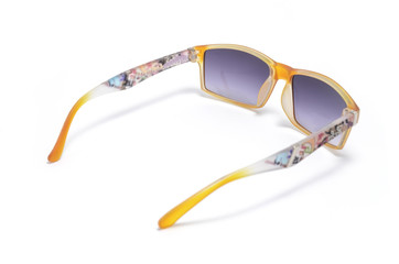 Sunglasses with transparent orange frame isolated on white