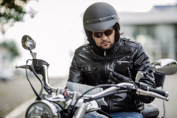 Fototapeta na wymiar man with motorcycle. people, travel lifestyle concept