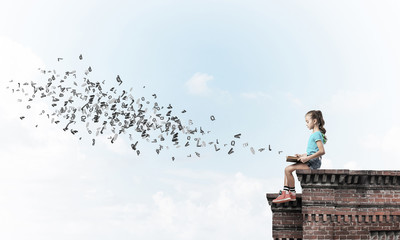 Concept of careless happy childhood with girl exploring this wor