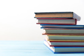 book stack on blue wooden table