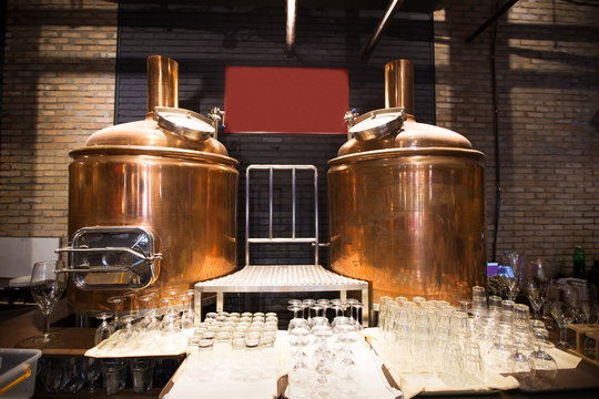 Copper Brewery Barrels And Wineglasses In Bar