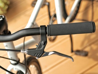 Bicycle handle bar with black grip and break.