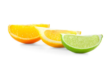 Fototapeta na wymiar Slices of delicious citrus fruits on white background