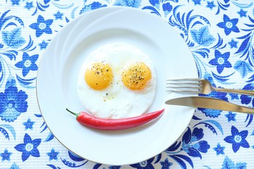 Funny eggs with red chile pepper 