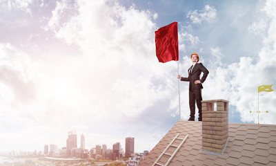 Young businessman with flag presenting concept of leadership. Mixed media