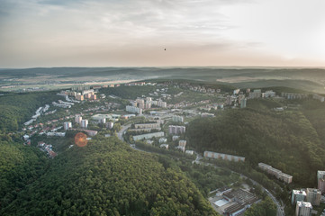Panorama view of housing estate between wooded hills in Brno, Czech Republic