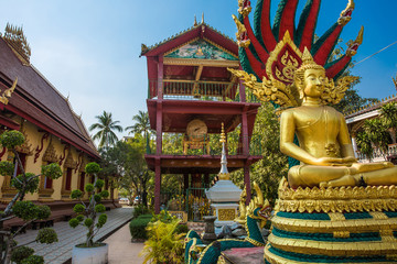 Big Buddha statue at temple with blue sky in the morning