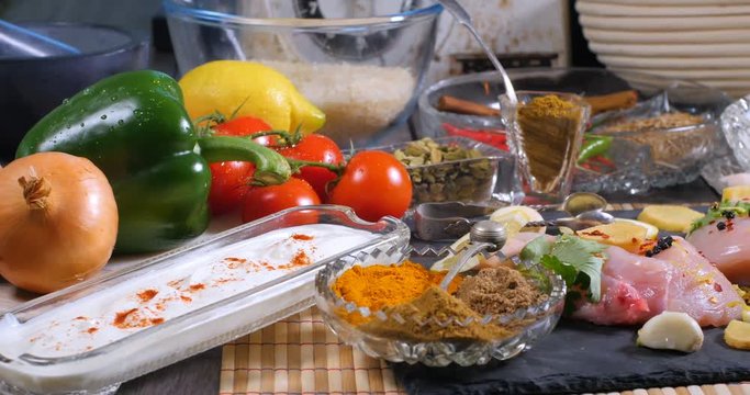 Dolly view of ingredients and indian spices for chicken tikka masala