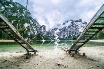 Lake Braies also known as Lago di Braies. The lake is surrounded by the mountains which are reflected in the water.1st point of the trekking route Alta Via 1, The Dolomites, Alps, South Tyrol, Italy.