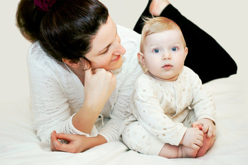 Mom is looking at cute baby