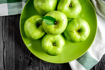 fitness food with green apples on dark background top view mockup