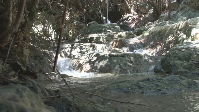 Stream flows through large rocks
