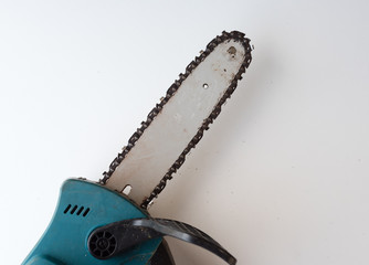 High angle cropped view of chainsaw on white background (selective focus)