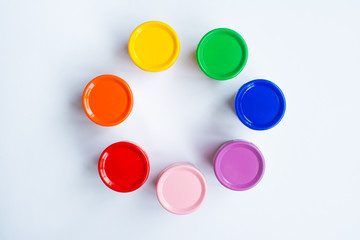 Multicolored gouache on a white background in the shape of a flower