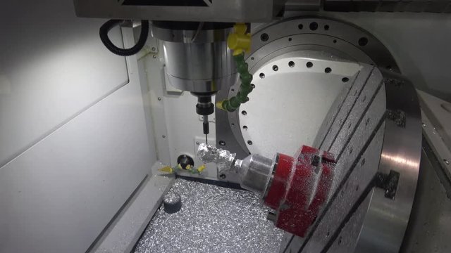 Full 5-axis Spinner machine. Close up of metal processing