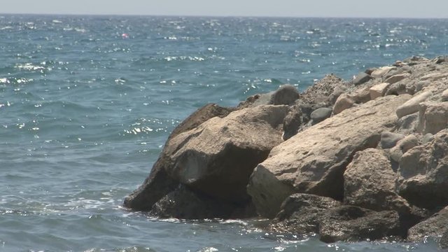 Ocean waves hit rocky coast of Cyprus