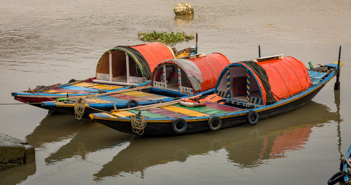 Wooden boats lined up at the Ganges river bank. These country boats are used for pleasure boating rides on the river.