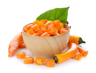 yellow chili in wood spoon on white background