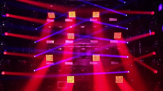 Colorful laser lights on the stage. Professional color lighting and sound show effects. Background of concert light flashes