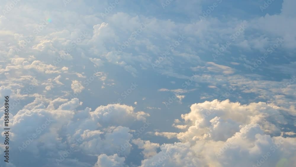 Wall mural clouds while flight.view through an airplane window.