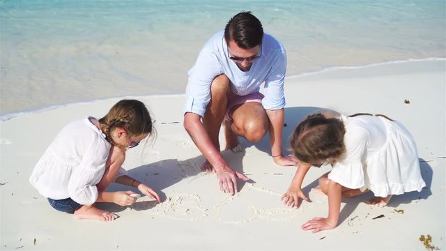 Happy family at tropical beach have fun. Father and little kids enjoy time together on white sand beach on their holiday