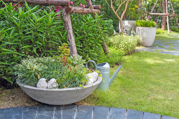 a small plants are beautifully arranged in pots in the garden.