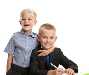 Schoolboy embracing brother