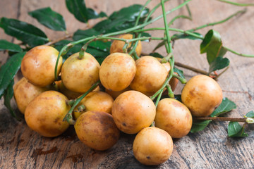 Rambeh fruit isolate on wooden table background
