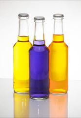 Orange and purple drinks are contained in a glass jar and the lid completely closed. And shadows, set in the studio.