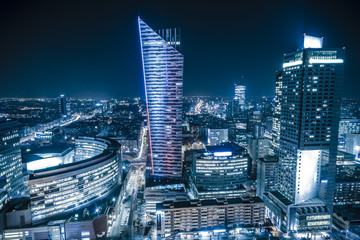 Naklejka na ściany i meble Warsaw,Poland October 2016:Warsaw city with skyscrapers at night