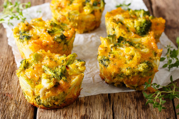 Delicious and healthy broccoli bites with cheddar cheese, egg and thyme close-up. horizontal