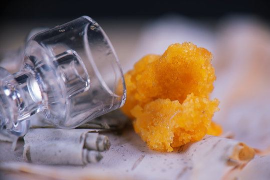 Marijuana extraction concentrate aka wax crumble on wood background