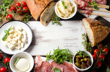 Various types of italian food on  wooden board