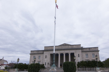 Fototapeta na wymiar Patriot's Theater - Flag Pole, Front