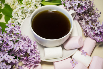 Good morning! Lilac flowers and coffee