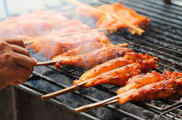 Grill chicken in bamboo stick , street food of Thailand.