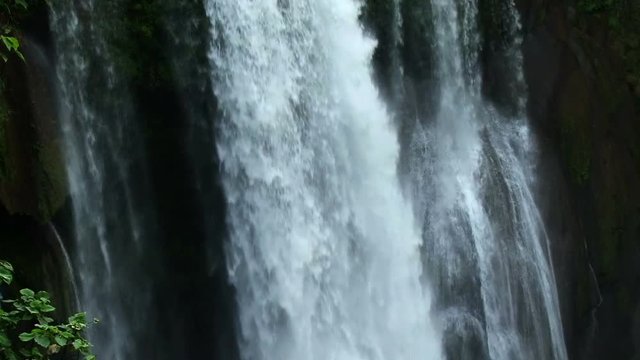 Close shot of white water falling down of Pulhapanzak waterfall in Honduras