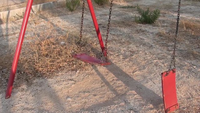 Empty swing swings with groan, audio