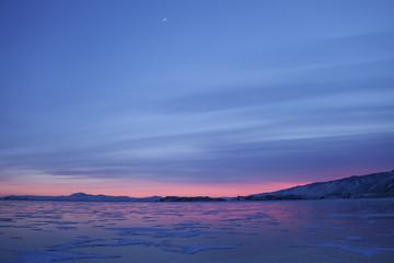 Lake Baika. Cape Uyuga sunset winter landscape