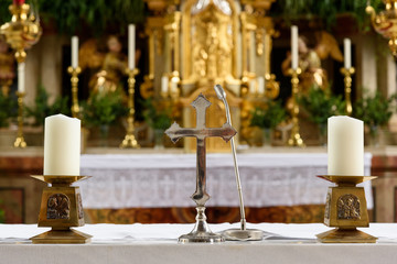 Church's altar with crucifix and candles