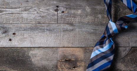Father's day concept - present, tie on rustic wood background © anaumenko