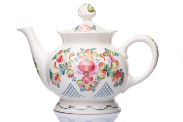 Teapot white porcelain with patterns for drinks on a white background