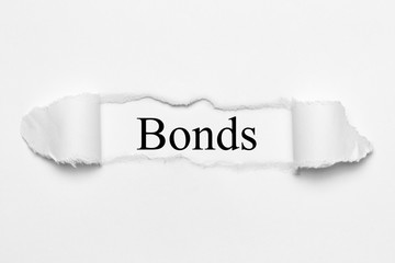 Bonds on white torn paper
